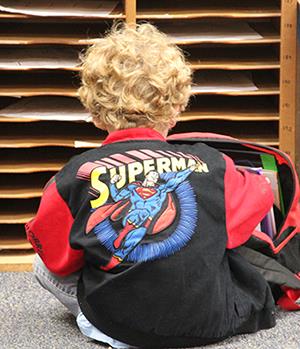 back of boy's jacket shows Superman 
